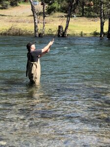Man casting with a fishing pole.